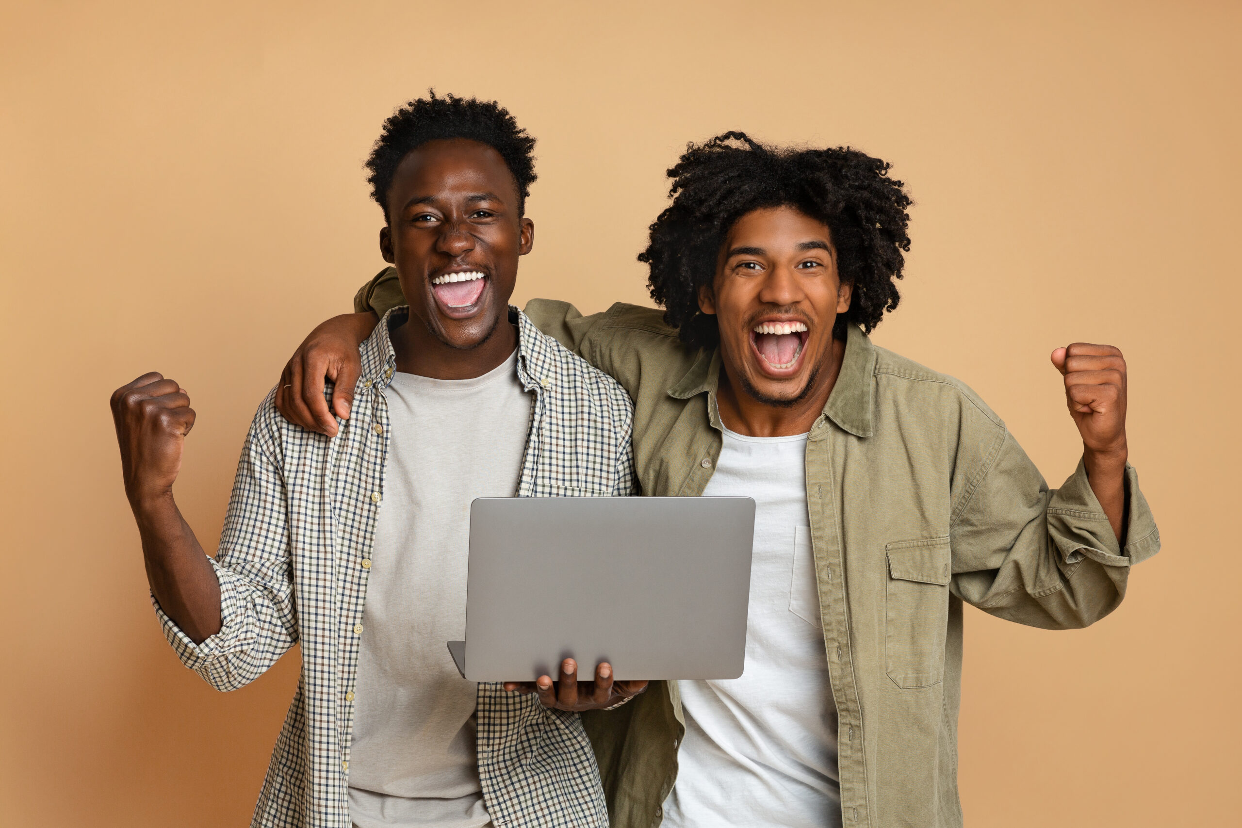 online-lottery-two-cheerful-black-guys-celebratin-2023-11-27-05-07-56-utc-scaled.jpg