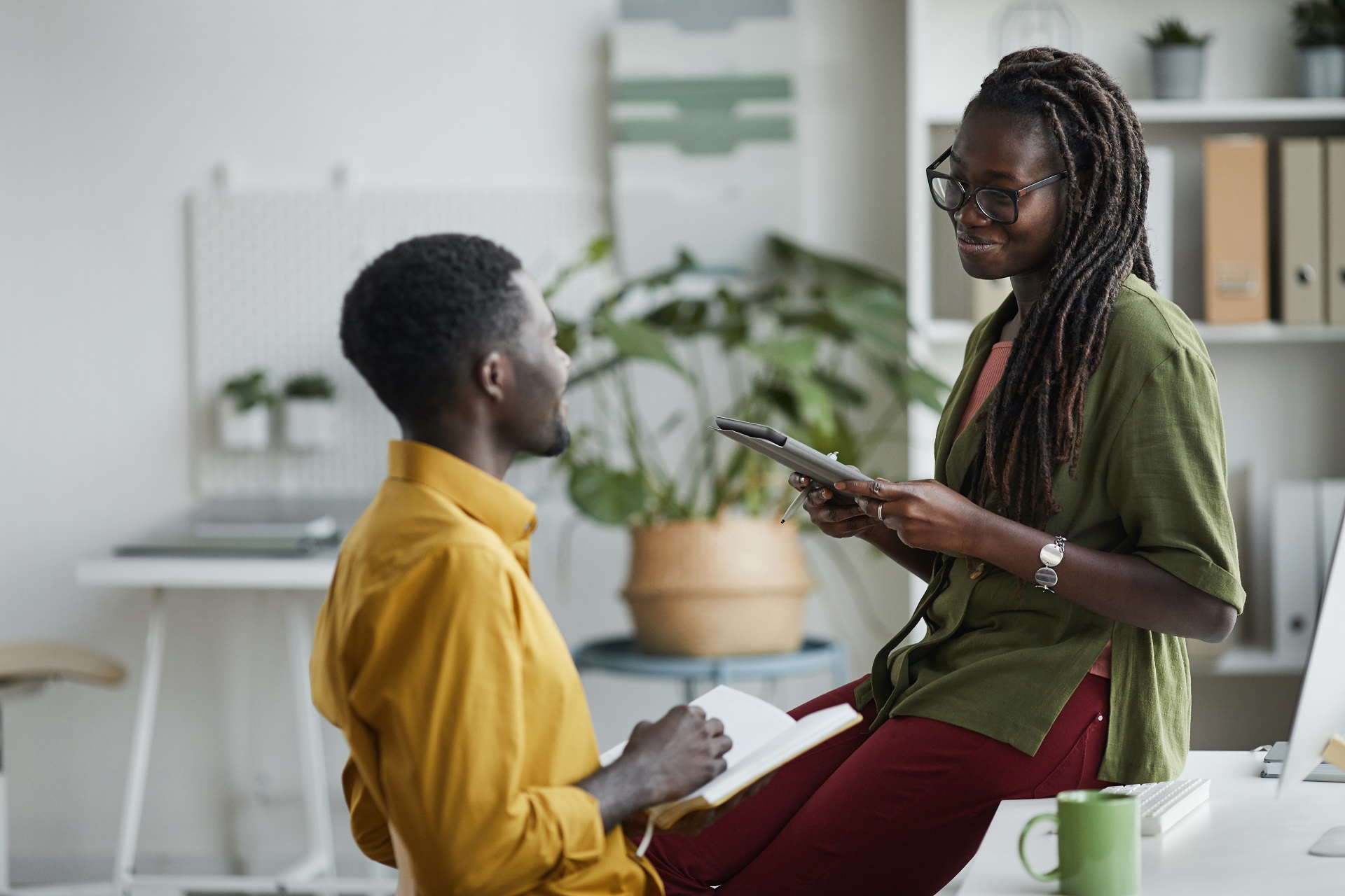 young-african-american-people-chatting-in-office-2023-11-27-05-34-12-utc.jpg